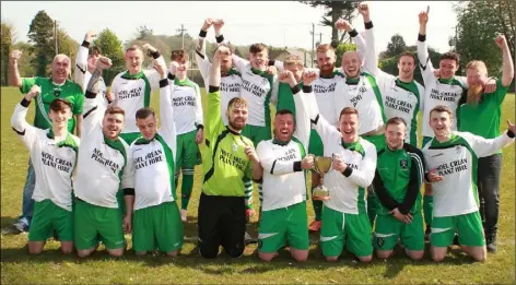  ??  ?? Division 4A champions Cloughbawn celebrate.