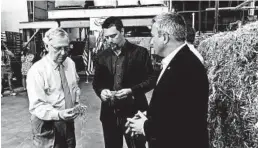  ?? BRUCE SCHREINER/AP ?? Sen. Mitch McConnell, left, inspects hemp taken from a bale at a processing plant.