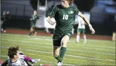  ?? PETE BANNAN — DAILY LOCAL ?? Bishop Shanahan’s (10) Zane Domsohn gets the ball past the Donegal goalie in the first period of State playoffs Tuesday evening. The Eagles went on to a 2-0victory.