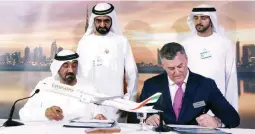  ??  ?? Sheikh Ahmed bin Saeed Al Maktoum (left), CEO &amp; Chairman of Emirates Airline, Kevin Mcallister (R), Executive VP &amp; CEO of Commercial Airplanes Boeing, sign contract during the press conference at Dubai Air Show in Dubai, UAE November 12, 2017. (Reuters)