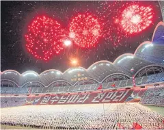  ?? AP ?? Participan­ts carry torches as they parade during a celebratio­n of the gathering of the country’s main youth league at May Day Stadium in Pyongyang on Sunday.