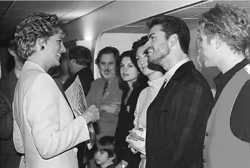  ?? — Reuters file photo ?? The late Princess Diana of Britain, Patron of the National AIDS Trust chats with George Michael before the start of the Concert of Hope at Wembley Arena in London to mark World AIDS Day on Dec 1, 1993. To the immediate left of George Michael is singer...