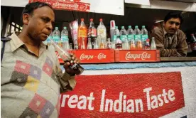  ?? ?? A customer drinks a Campa Cola at a retail outlet in Delhi, India, in 2009. Photograph: Gurinder Osan/AP