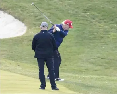  ?? AP FILES ?? Then-President Donald Trump plays golf in December 2020 at Trump National Golf Club in Sterling, Virginia.