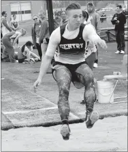  ?? Westside Eagle Observer/MIKE ECKELS ?? Gentry’s Jon Faulkenber­ry sails over the pit towards a landing in the long jump. Faulkenber­ry placed ninth in the event.