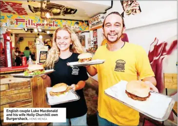  ?? HONG MENEA ?? English couple Luke Macdonald and his wife Holly Churchill own Burgershac­k.