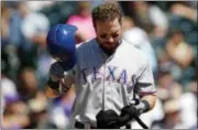  ?? DAVID ZALUBOWSKI — THE ASSOCIATED PRESS FILE ?? In this file photo, Texas Rangers’ Josh Hamilton reacts after striking out against the Colorado Rockies in the fifth inning of a baseball game in Denver. The Rangers have released Hamilton from his minor league contract after another knee injury,...