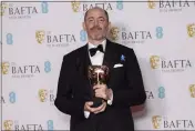  ?? PHOTO BY VIANNEY LE CAER — INVISION — AP ?? Edward Berger poses for photograph­ers with the Director Award for the film `All Quiet on the Western Front' at the 76th British Academy Film Awards, BAFTA's, in London on Feb. 19.