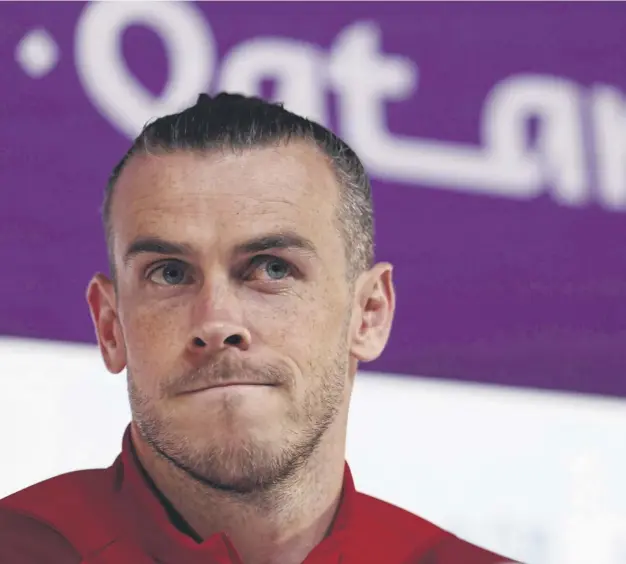 ?? ?? ↑ Wales forward Gareth Bale in front of the media at a press conference in Qatar ahead of the crucial World Cup Group A clash with England at the Ahmad bin Ali