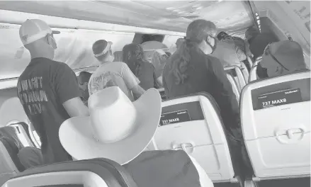  ?? CHARLIE RIEDEL/AP ?? Passengers exit the plane after arriving in March at Houston’s Hobby airport. Domestic airfare prices are expected to rise this year.