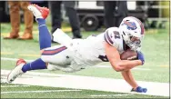  ?? Elsa / Getty Images ?? Tyler Kroft of the Buffalo Bills falls down after catching the ball for a reception against the New York Jets in the fourth quarter at MetLife Stadium on Sunday in East Rutherford, N.J. The Bills won 18-10.