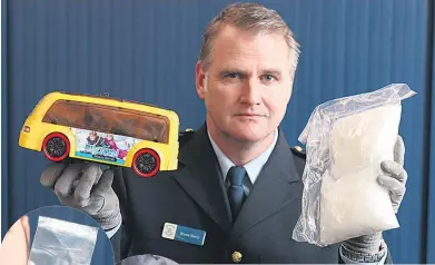  ?? Picture / Jason Oxenham ?? Above, methamphet­amine concealed in a toy bus. A bag of meth, left, and some Ecstasy, far left.