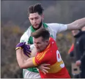  ??  ?? P.J. Banville and Pádraig Foley during the sides’ meeting in Tagoat in April, won by Horeswood.