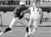  ?? JOHN RAOUX/AP ?? UCF offensive lineman Wyatt Miller (78) blocks Pittsburgh defensive lineman Rashad Weaver (17) during a recent game.