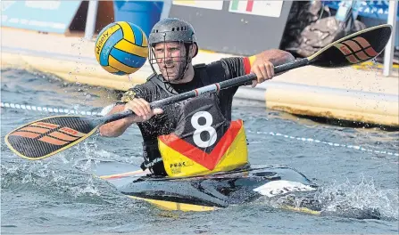  ?? BERND FRANKE THE ST. CATHARINES STANDARD ?? German team captain Jonas Vieren (8) bats the ball with his paddle in the senior men's final versus Italy at the world canoe polo championsh­ips.