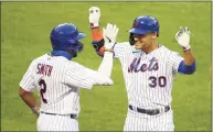 ?? Mike Stobe / Getty Images ?? Michael Conforto (30) and Dominic Smith (2) both agreed to one-year deals on Friday.