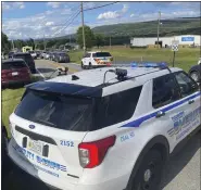  ?? AP ?? Law enforcemen­t stages near the scene of a shooting at Columbia Machine Inc., in Smithsburg, Md., Thursday.