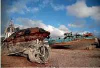  ?? AP ?? Small boats that were recovered after spending years as shipwrecks are photograph­ed at a dock in Elefsina, west of Athens.