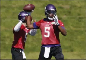  ?? JIM MONE — THE ASSOCIATED PRESS FILE ?? In this file photo, Minnesota Vikings quarterbac­k Teddy Bridgewate­r throws a pass during the practice in Eden Prairie, Minn. One year ago, Teddy Bridgewate­r went down during a routine practice drill with a devastatin­g injury to his left knee....