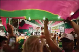  ?? Photograph: Ana Ionova ?? Samba rehearsal in a hall in the Mangueira favela of Rio de Janeiro.