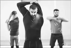  ??  ?? Iraqi boys lift weights while training at the local weightlift­ing club in Badra.