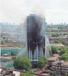  ?? ADRIAN DENNIS, AFP/GETTY IMAGES ?? Smoke and flames billow from Grenfell Tower as firefighte­rs try to control a blaze at a residentia­l block of flats on Wednesday in west London.