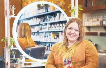  ?? DAVID JOLES/MINNEAPOLI­S STAR TRIBUNE ?? Erin Flavin, the Honeycomb Salon owner, quit drinking during the pandemic and will soon open a nonalcohol­ic bottle shop/bar next to her salon.