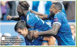  ??  ?? ■
WHAT A LIFT: Maguire is mobbed by Wilfred Ndidi and Wes Morgan after scoring