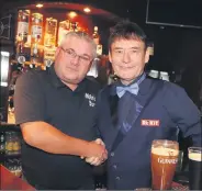  ?? (Pic: S Burke) ?? John O’Beirne welcomes snooker legend Jimmy White to Mitchelsto­wn last Wednesday week for a pool exhibition.