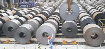  ??  ?? The United States stepped up its trade confrontat­ion with China, ordering an investigat­ion into imports of aluminium sheet worth hundreds of millions of dollars a year. — AFP photo