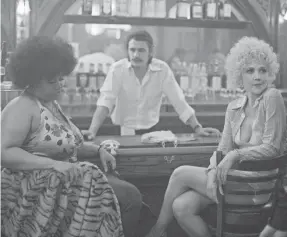 ??  ?? Ruby (Pernell Walker), left, Vincent (James Franco) and Eileen (Maggie Gyllenhaal) are witness to the rise of pornograph­y in the seedy Times Square of the 1970s in HBO’s “The Deuce.”
