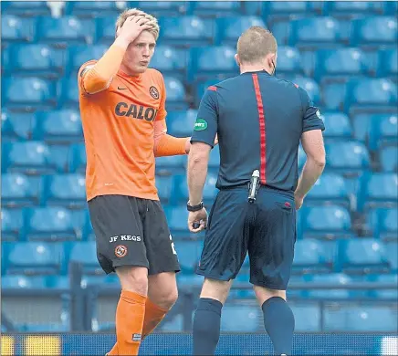  ?? Picture: SNS ?? NO FOUL: Coll Donaldson pleads his innocence to referee John Beaton after conceding the penalty.