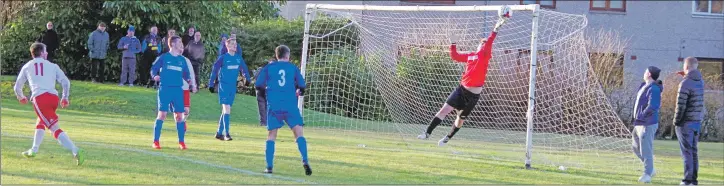  ?? Match report and photos Derek Black ?? Greenock keeper Neil Flack can’t keep Ally McKerrache­r’s header from looping into the top corner of the net during last Saturday’s Scottish Cup fourth round replay at Glencruitt­en.