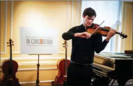  ?? CHRIS LEE VIA AP ?? In this photo provided by Chris Lee, Juilliard student Nathan Meltzer, recipient of the “Ames, Totenberg” Stradivari of 1734, plays the instrument in New York on Tuesday.