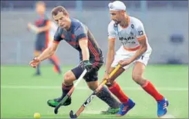  ?? HOCKEY INDIA ?? Mandeep Singh tries to get past a Dutch defender in their match on Monday.