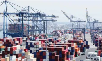  ?? — Reuters ?? Ship and containers are shown at the port of Los Angeles in Los Angeles, California.