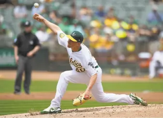  ?? Thearon W. Henderson / Getty Images ?? A’s starter Chris Bassitt said his adrenaline was “crazy” in the early innings as he made his first major-league appearance since April 2016; he had Tommy John surgery the next month.