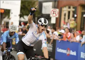  ?? BEN HASTY — MEDIANEWS GROUP ?? Boyertown native Shane Kline celebrates his win Aug. 4 at the Reading Radsport Men’s Hill Climb.