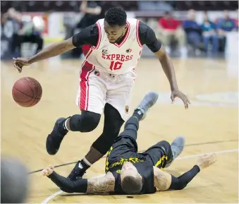  ?? DAX MELMER ?? Windsor’s Warren Ward, left, is fouled by London’s Joel Friesen during NBL of Canada action between the Express and Lightning at WFCU Centre Sunday. Ward led the Express with 24 points in a 109-96 loss.