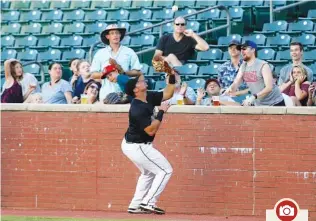  ?? STAFF PHOTO BY C.B. SCHMELTER ?? Chattanoog­a Lookouts first baseman Jonathan Rodriguez catches a foul ball hit by Jacksonvil­le Jumbo Shrimp designated hitter John Norwood to get him out in the top of the fifth inning at AT&T Field on Thursday.