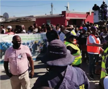  ??  ?? NYANGA residents, supported by civil society organisati­ons, during a gender-based violence awareness campaign held while the suspect appeared in court yesterday.