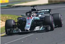  ?? PHOTO: GETTY IMAGES ?? Setting the pace . . World champion Lewis Hamilton guides his Mercedes around the Albert Park track during the first practice session for the Australian Grand Prix in Melbourne yesterday.