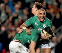 ?? PHOTO: REUTERS ?? Ireland’s Iain Henderson celebrates scoring their first try with Simon Zebo.