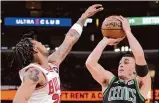  ?? Charles Rex Arbogast/ Associated Press ?? Boston Celtics’ Payton Pritchard shoots against Chicago Bulls Saturday.