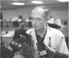  ?? DAX MELMER ?? Dr. Anil Dhar talks to reporters about local flu cases following a Windsor Regional Hospital board of directors meeting at the Met Campus on Thursday.