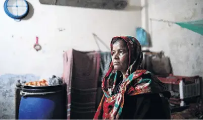  ?? PHOTOS: REUTERS ?? Haunted . . . Lutfa Begum (40), a Rana Plaza victim, poses for picture at her home in Savar, near Dhaka.