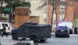  ?? The Associated Press ?? A SWAT vehicle turns near the scene of a shooting involving several police officers in downtown Seattle on Thursday.