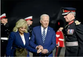  ?? AP ?? US President Joe Biden and first lady Jill Biden are escorted by Colonel Edward Bolitho, Lord Lieutenant of Cornwall, right, as they arrive on Air Force One at Cornwall Airport, Newquay.