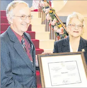  ?? DAVE STEWART/THE GUARDIAN ?? Roger Gallant of Summerside receives a Canadian Coast Guard exemplary service medal from Lt.-Gov. Antoinette Perry during a recent ceremony at Government House. He was one of eight individual­s honoured.