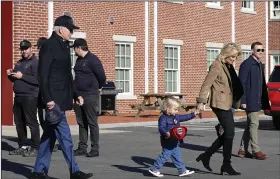  ?? (AP/Susan Walsh) ?? First Lady Jill Biden (right) walks with her grandson Beau Biden and President Joe Biden following a visit with firefighte­rs on Thanksgivi­ng Day at the Nantucket Fire Department Thursday in Nantucket, Mass.